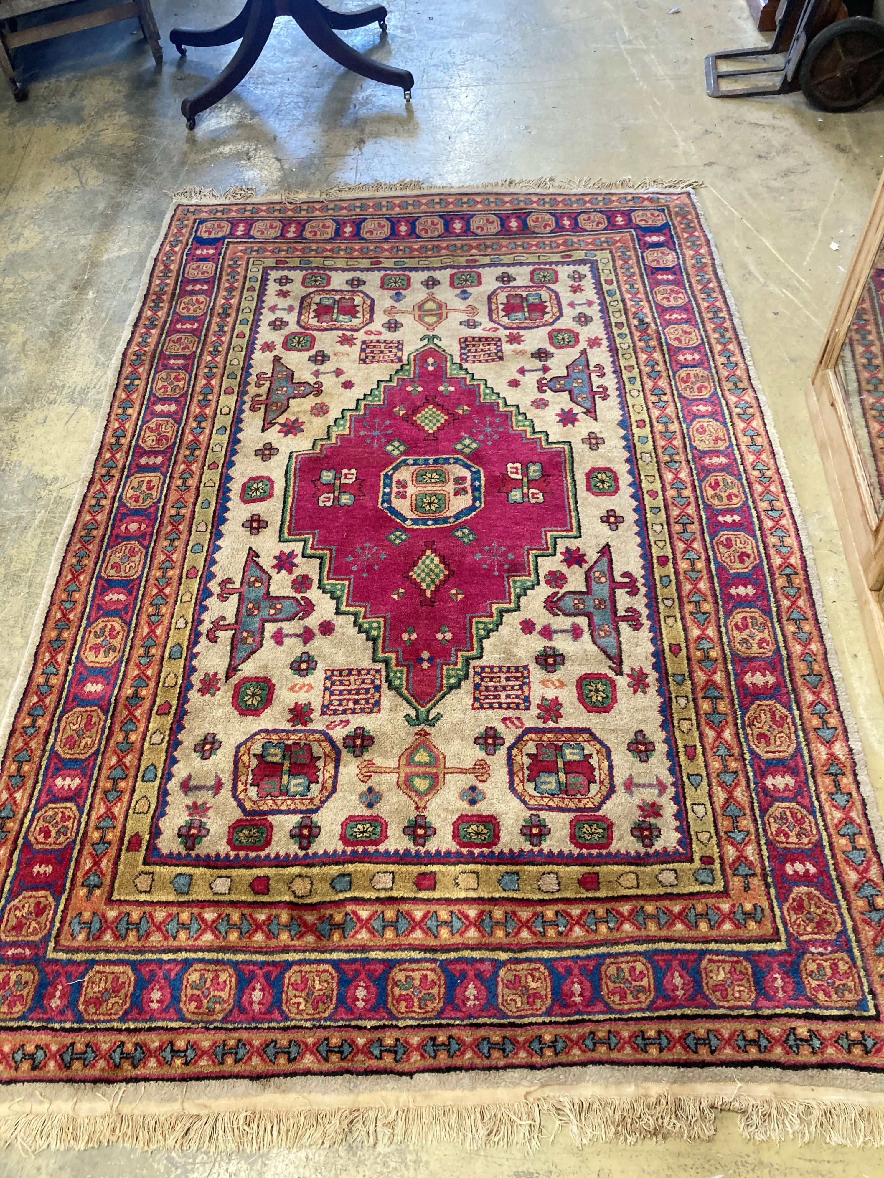 A Caucasian design ivory ground rug, 240 x 154cm